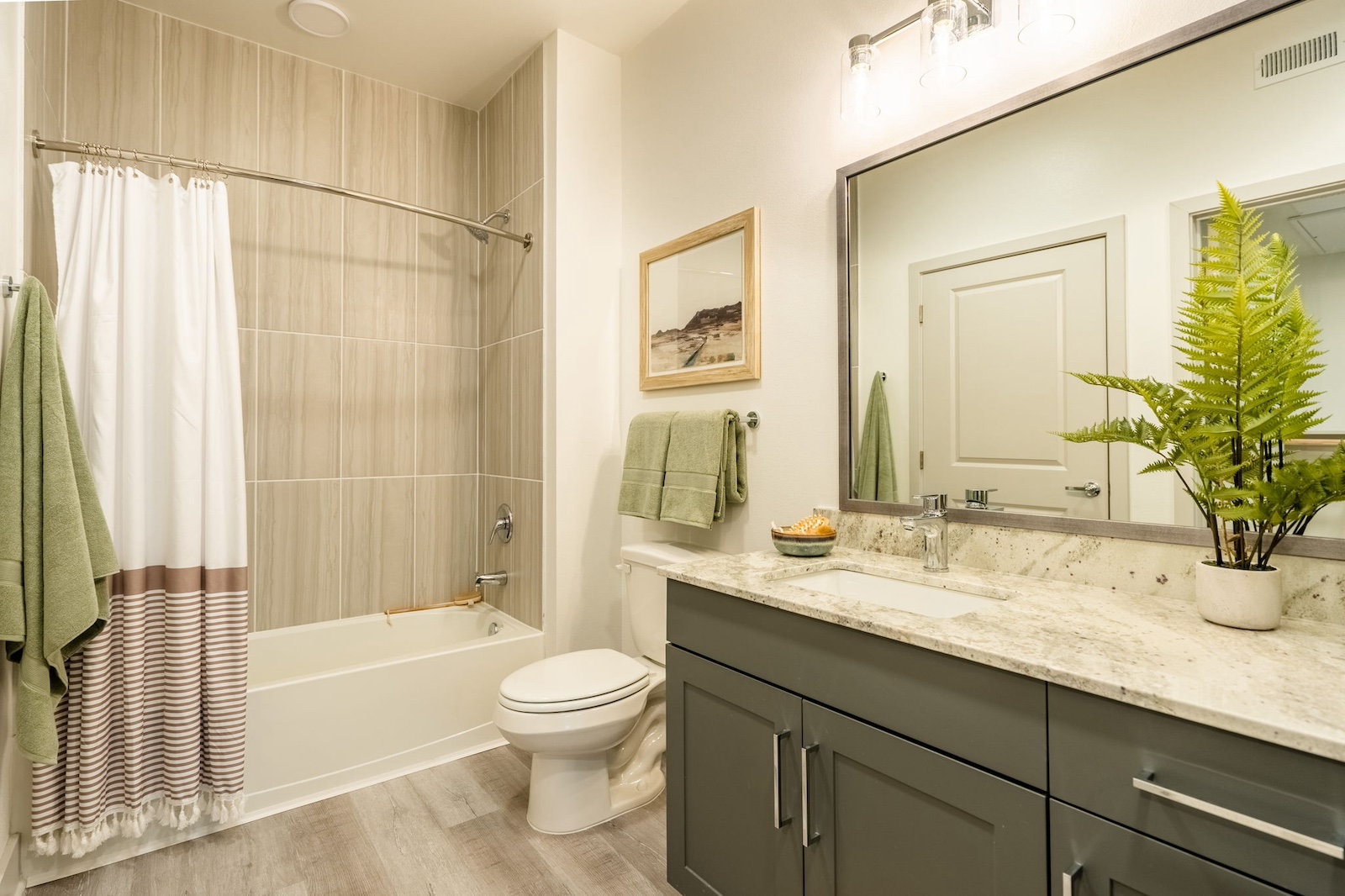 Bathroom with granite countertops and modern tile at our Cypress, TX apartments for rent. Residences