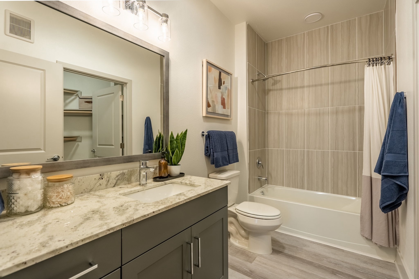 Bathroom with granite countertops and modern tile at our Cypress, TX apartments for rent.